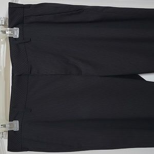 Size 32X32 Van Heusen pin striped dress pants, black with gray stripes.